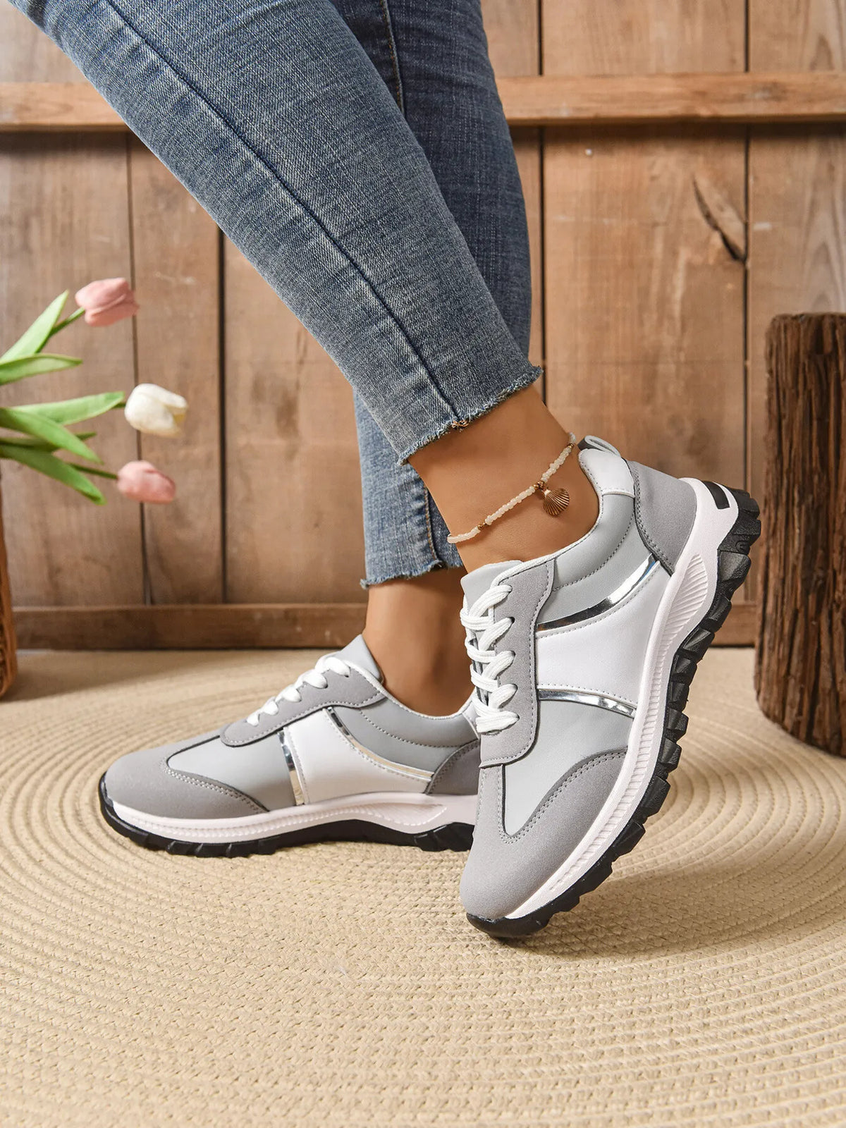 Contrast lace-up sneakers from Trendsi featuring stylish design, white and black color accents, and durable rubber sole.