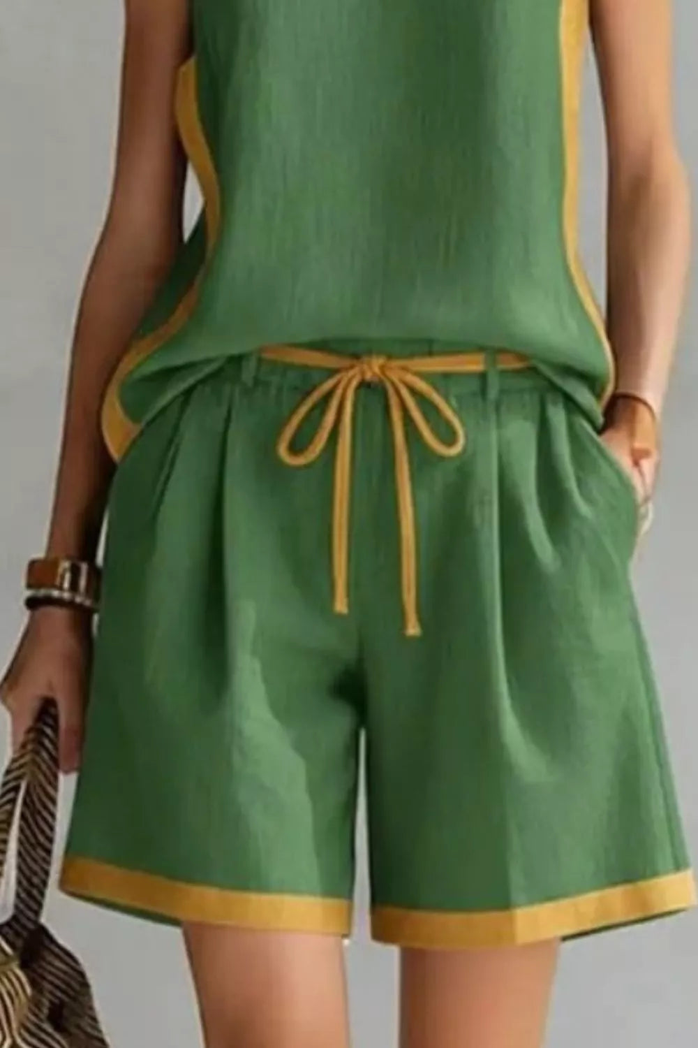 Contrast trim sleeveless tank and shorts loungewear set by Trendsi, featuring a comfortable sleeveless top and matching shorts.
