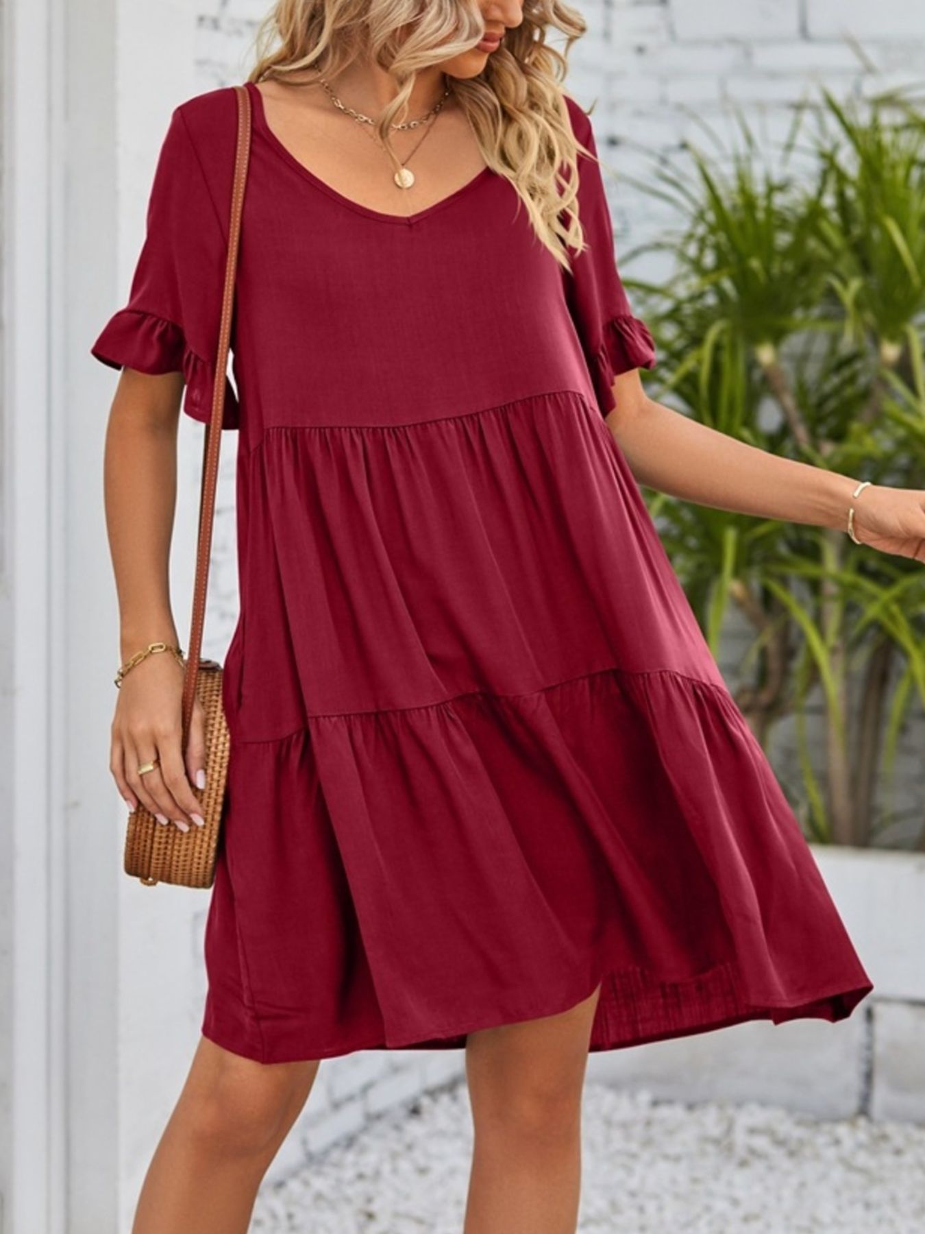 Lightweight rayon ruffled sleeve tiered mini dress with pockets, stylish and flowy, perfect for casual summer wear.