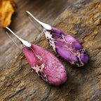 Teardrop-shaped natural stone dangle earrings by Shopimist, featuring elegant jewelry design with polished stones.