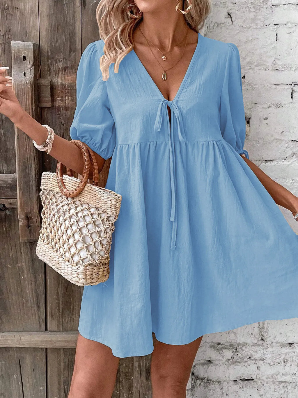 Cotton V-neck tie-front mini dress with puff sleeves from Trendsi, showcasing a stylish and breathable summer dress.