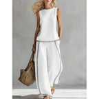 Printed retro sleeveless top and wide-leg pants set from Plush Fashion Hub, featuring vibrant patterns in a two-piece design.