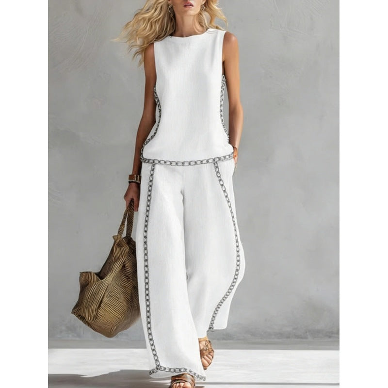 Printed retro sleeveless top and wide-leg pants set from Plush Fashion Hub, featuring vibrant patterns in a two-piece design.