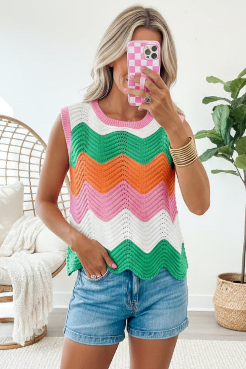 Women’s rainbow-striped cropped sweater vest by FitiqueFit, featuring vibrant horizontal rainbow stripes and a casual, stylish fit.