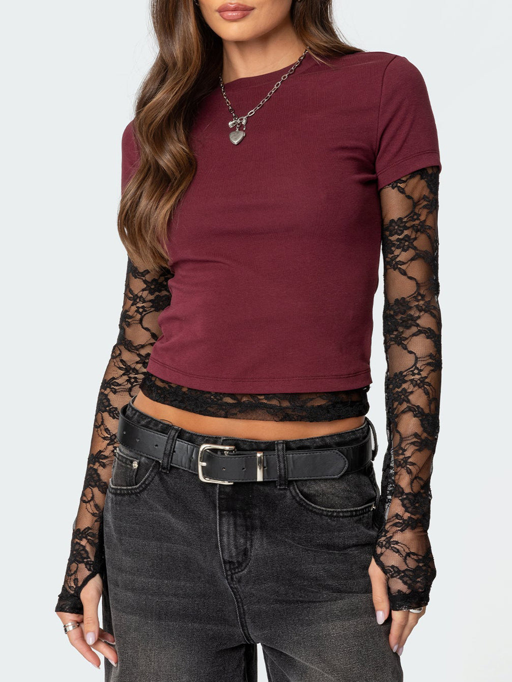 Women's elegant lace sleeve fitted T-shirt from Trendsi, showcasing a sophisticated casual top with lace detail and a sleek fit.