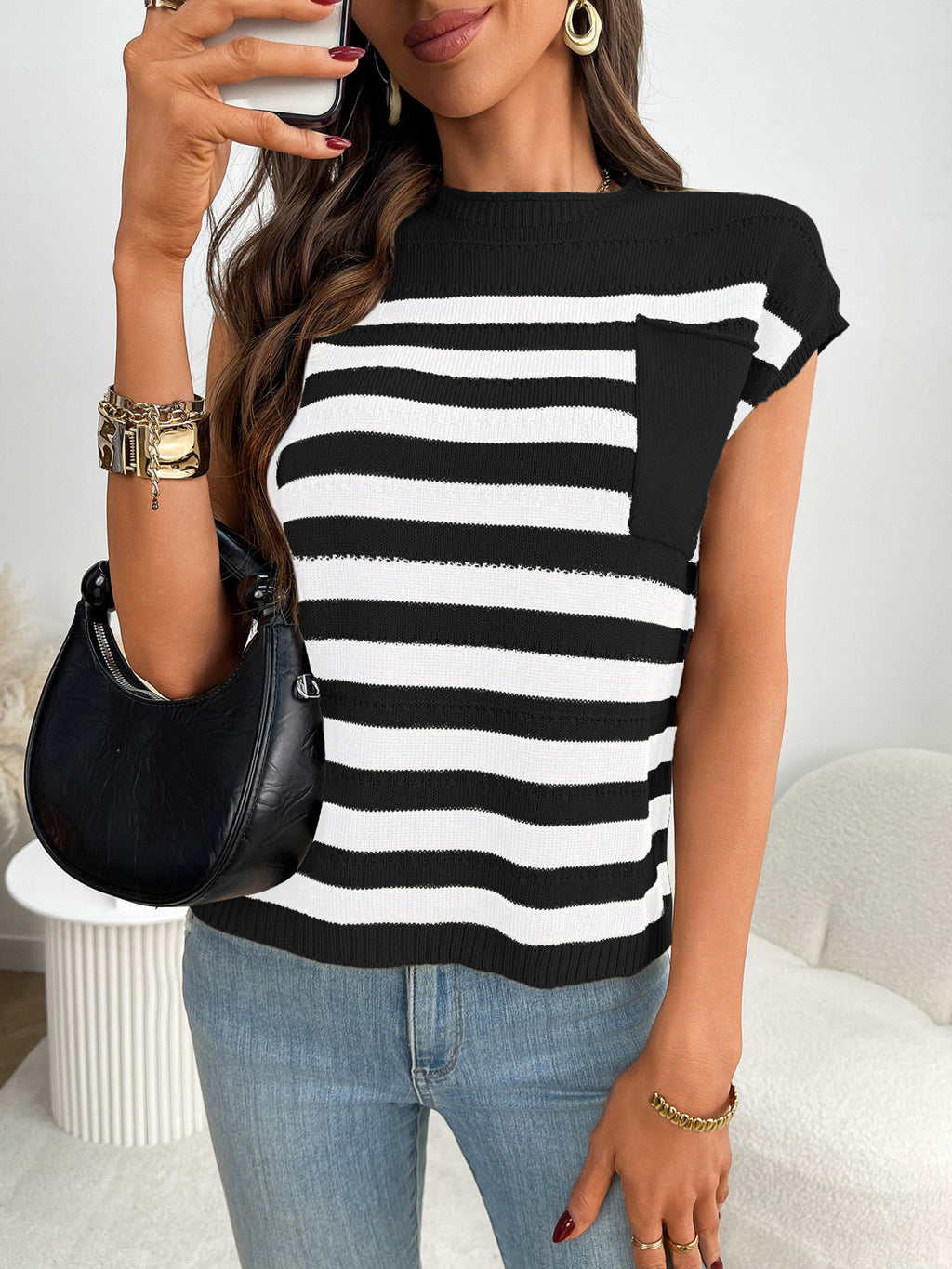 Women’s striped knit cap sleeve sweater with pocket detail, trendy outerwear by Trendsi, shown in a close-up image.