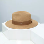 Women’s wide brim straw sun hat by Plush Fashion Hub, classic summer beach accessory with a stylish straw design.
