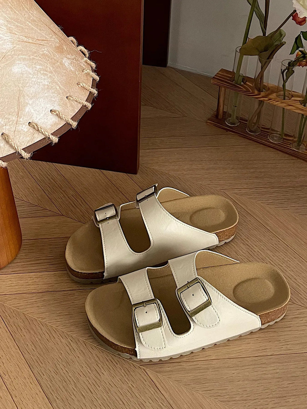 Comfortable flat PU leather sandals with double buckles from Trendsi, featuring a chic design and slip-on style.