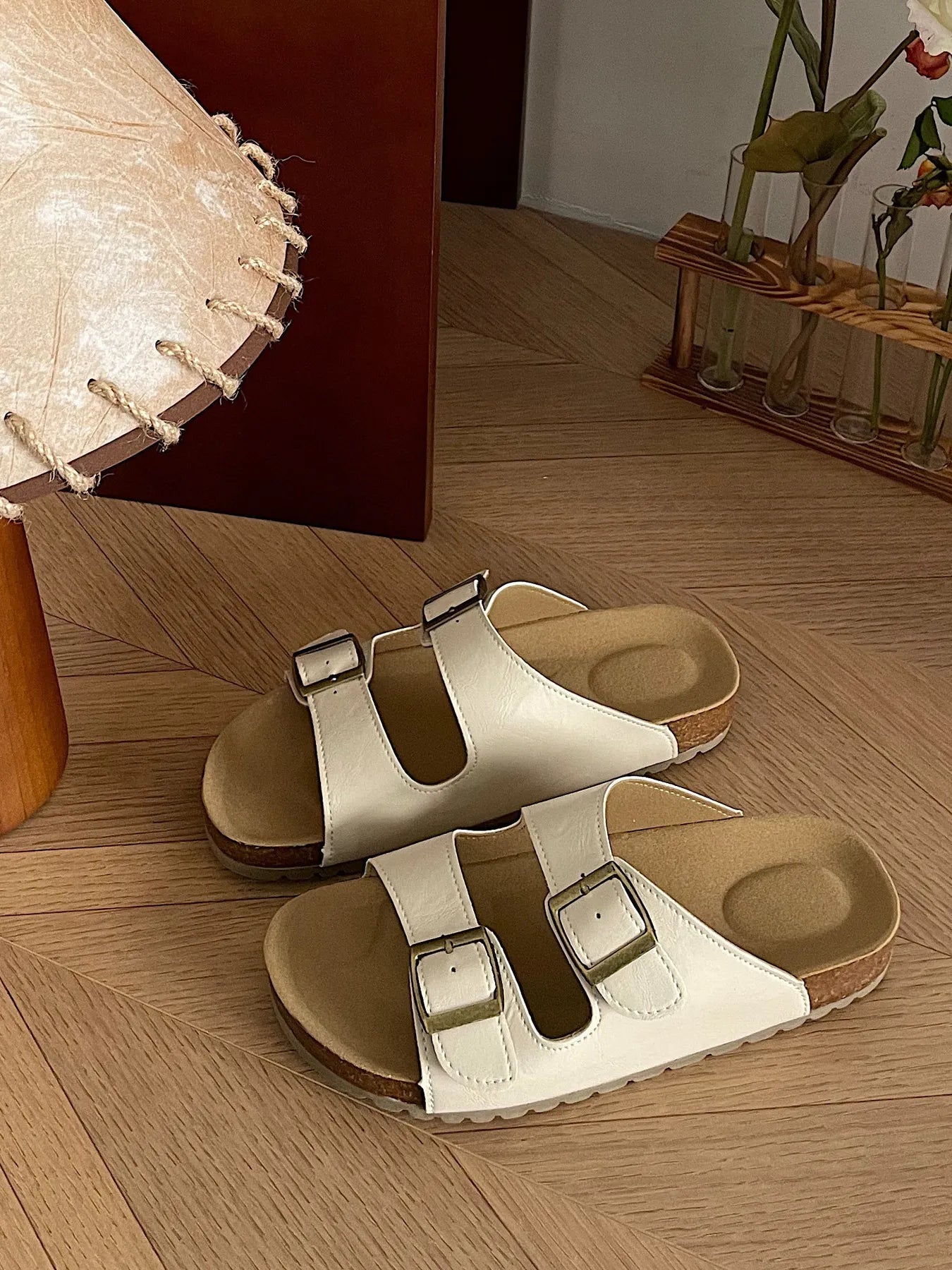 Comfortable flat PU leather sandals with double buckles from Trendsi, featuring a chic design and slip-on style.