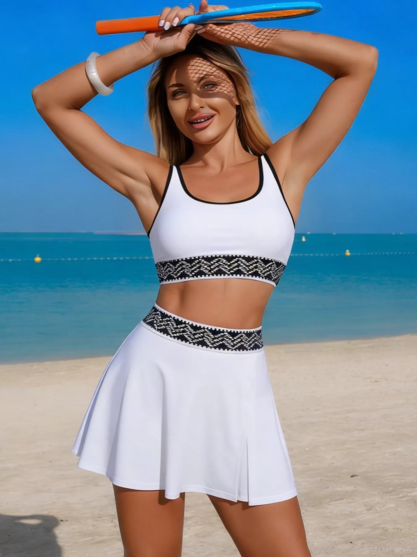 Contrast trim tank top and skort swim set by Trendsi, stylish two-piece swimwear, featuring a tank top and matching skort for beachwear.
