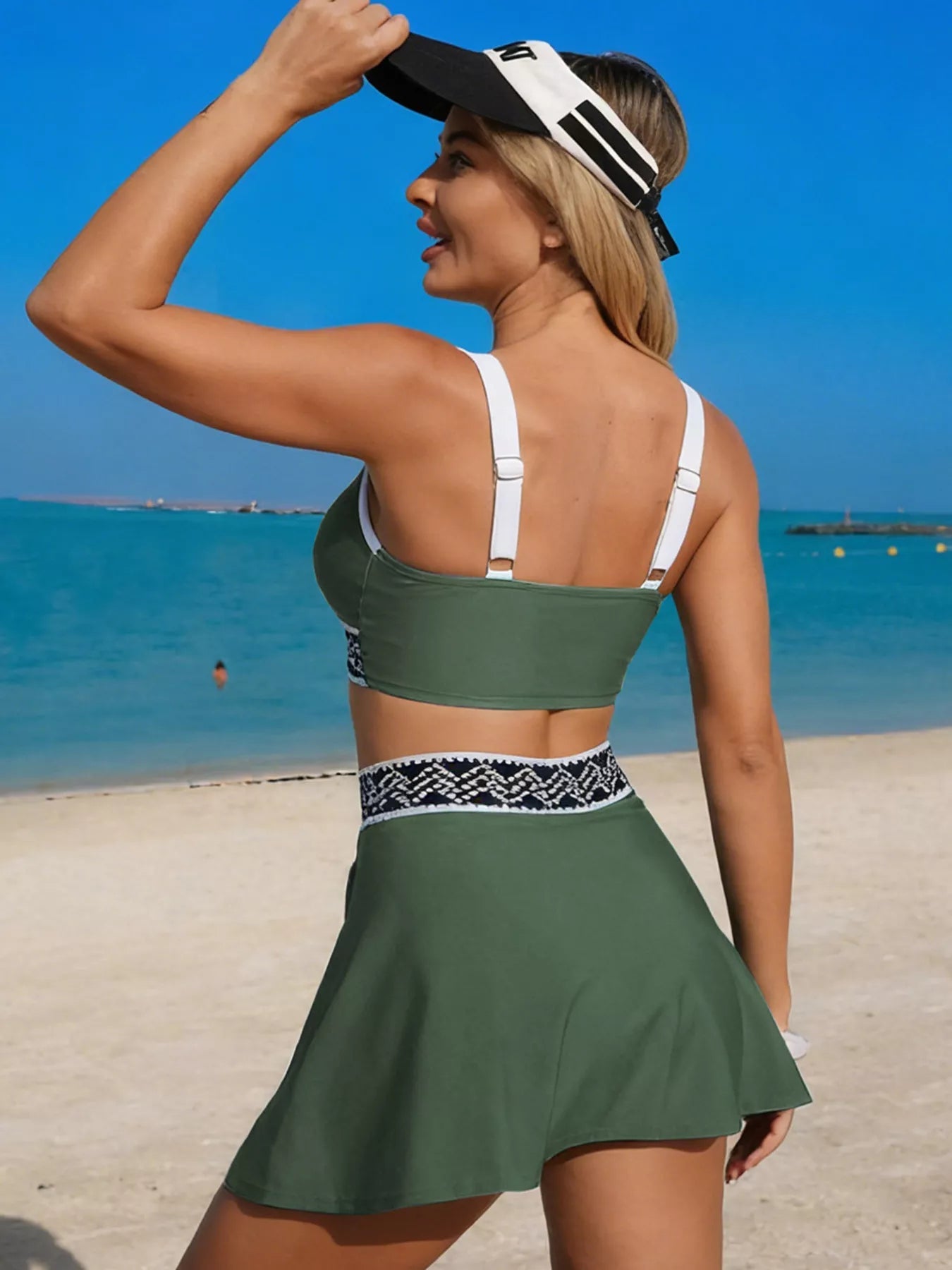 Stylish two-piece swimwear set with contrast trim tank top and skort, by Trendsi, perfect for beach or poolside fun.