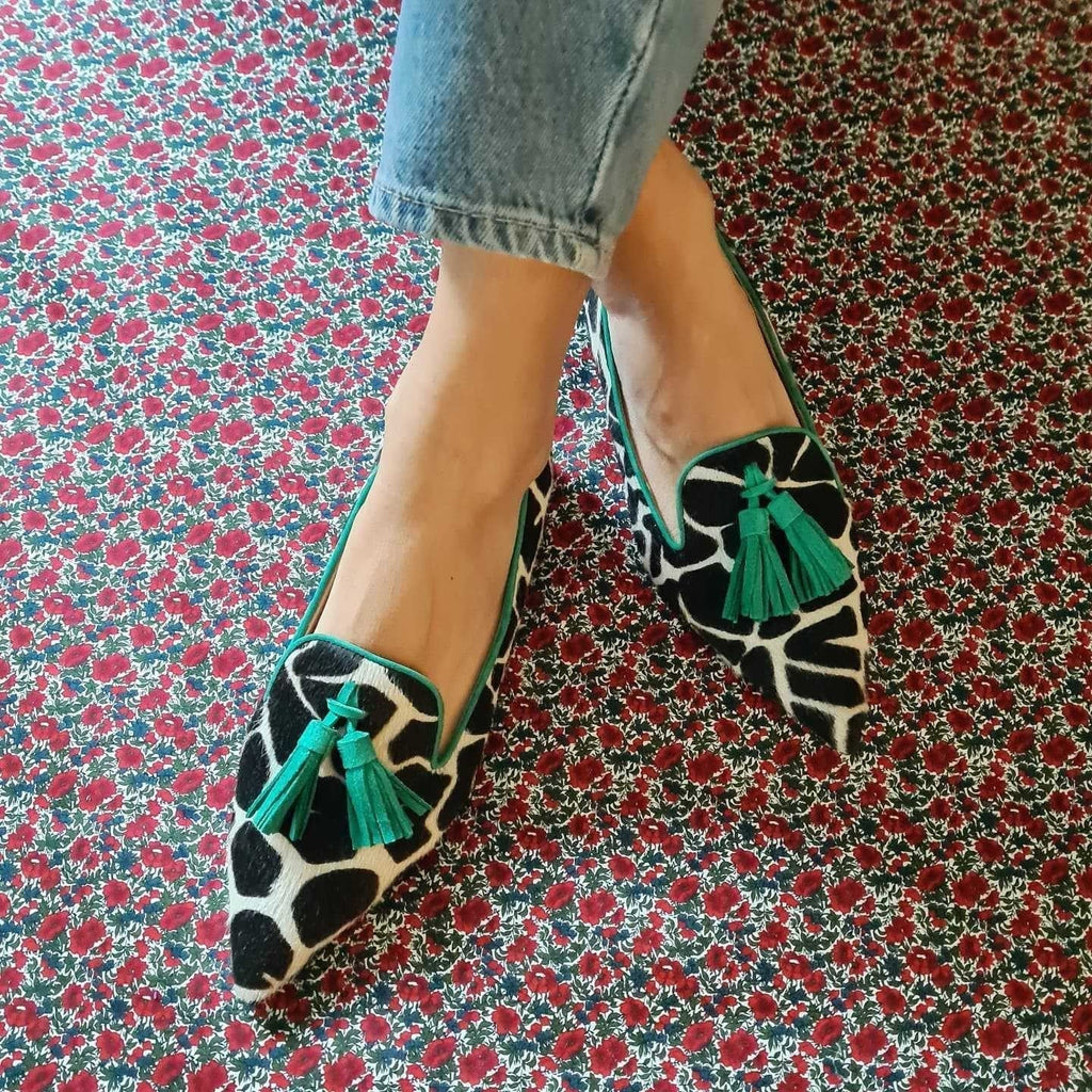 Cow print tassel pumps for women by Plush Fashion Hub, casual slip-on footwear with stylish tassel details and comfortable design.