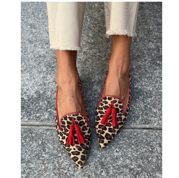 Cow print tassel pumps for women by Plush Fashion Hub, casual slip-on footwear with stylish tassels.