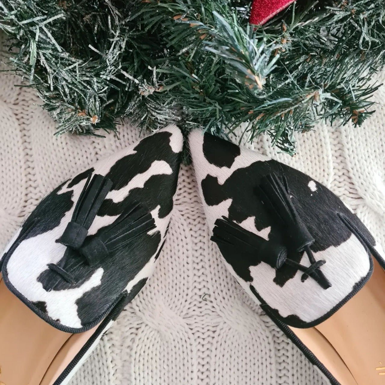 Cow print tassel pumps for women by Plush Fashion Hub, casual slip-on footwear with stylish tassel details.