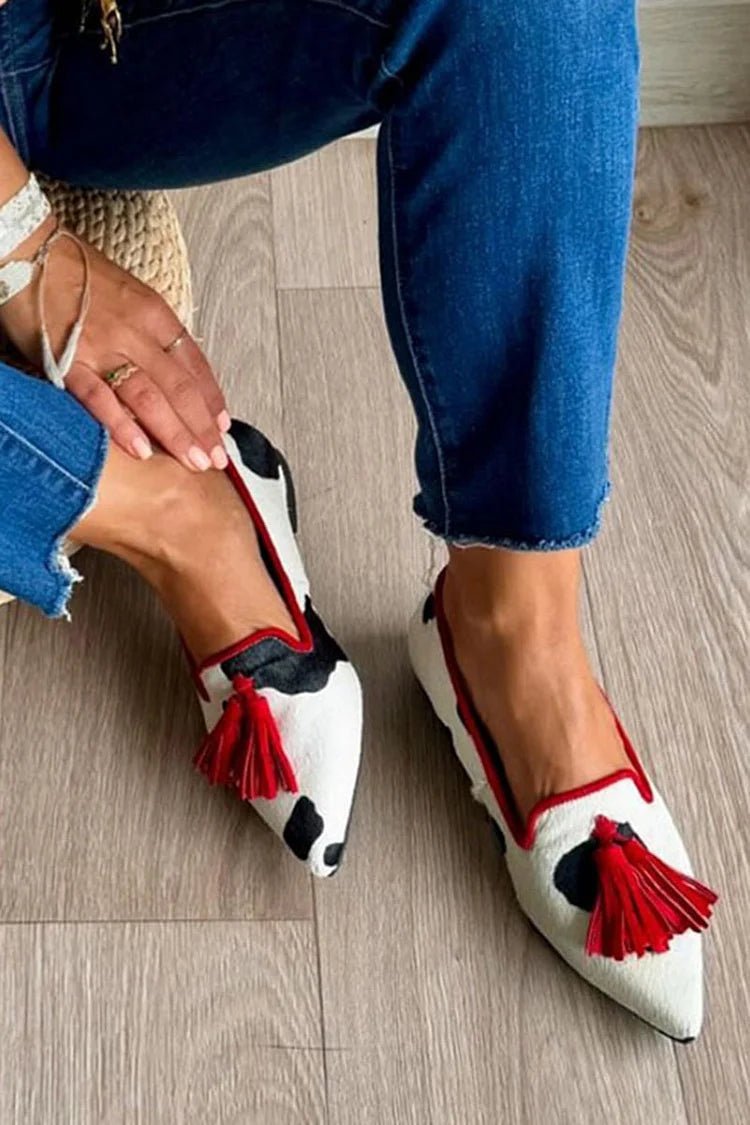 Cow print tassel pumps for women, casual slip-on footwear by Plush Fashion Hub with stylish tassel detail.