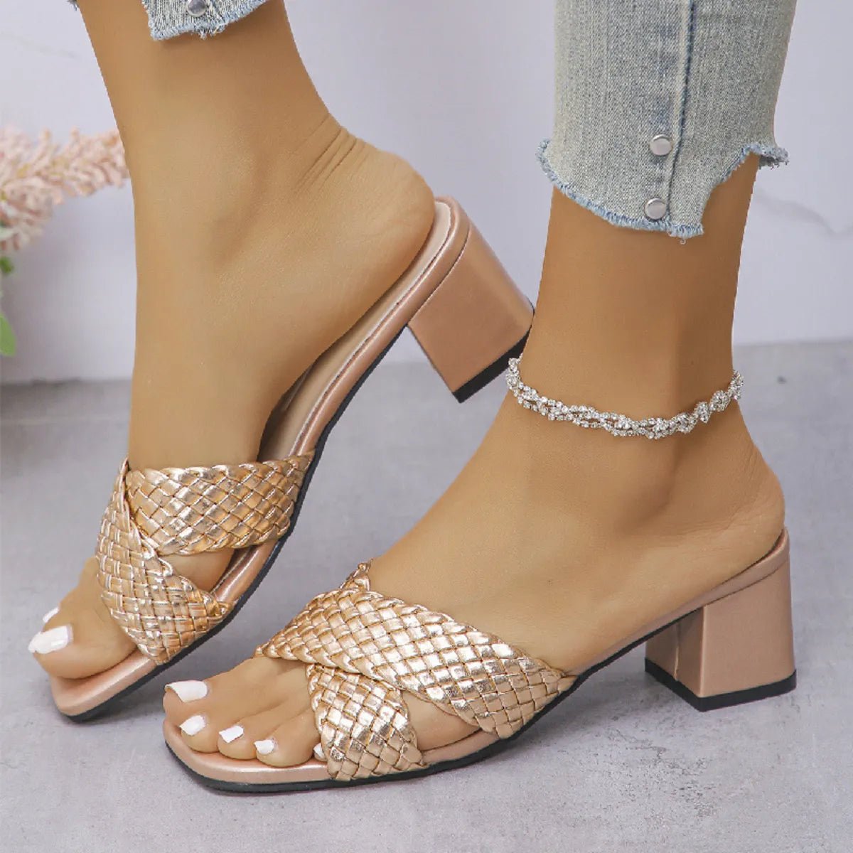 Women's crisscross PU leather block heel sandals with stylish mid-heel design, featuring open toes and ankle straps.