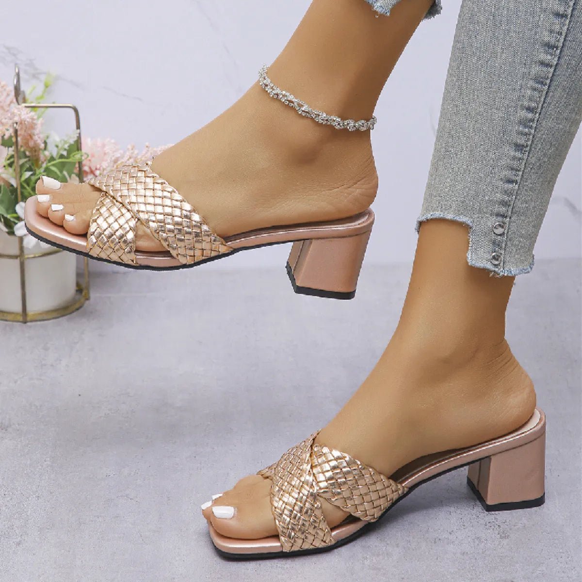 Women's crisscross PU leather block heel sandals with stylish mid-heel design, featuring adjustable ankle straps and open toe style.