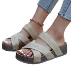 Women's crisscross open-toe platform sandals with faux leather straps and flat soles, designed for comfort and style.