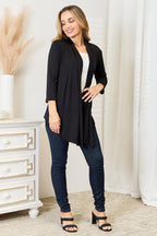 Women's lightweight draped open front cardigan with 3/4 sleeves, styled as a versatile layering piece in soft fabric.