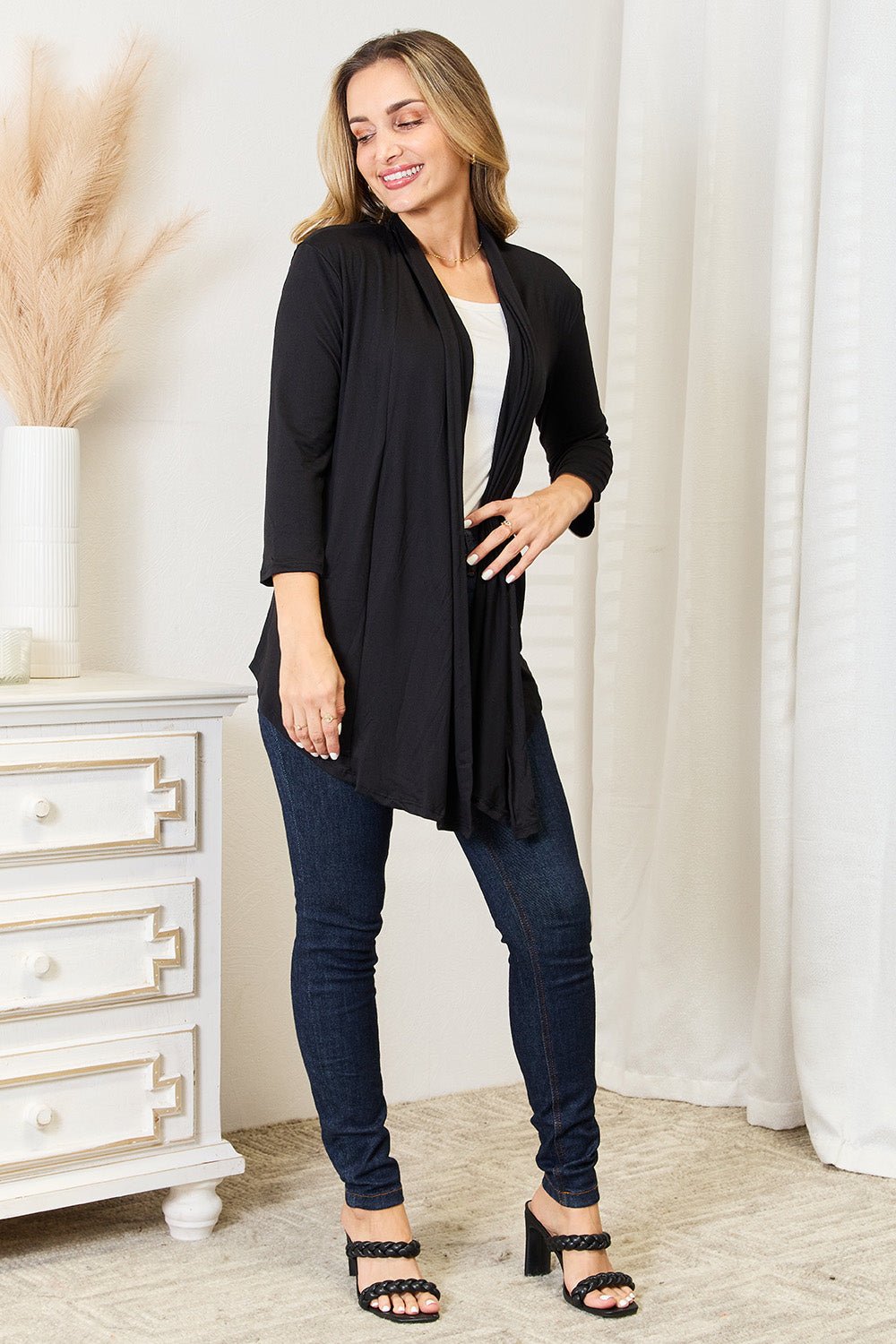 Women's lightweight draped open front cardigan with 3/4 sleeves, styled as a versatile layering piece in soft fabric.