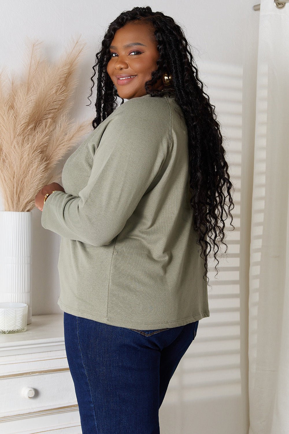 Women’s V-neck long sleeve cotton blend T-shirt by Trendsi, showing a close-up of the soft fabric and classic fit.