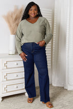 Women's V-Neck Long Sleeve Cotton Blend T-Shirt from Trendsi, featuring a classic fit and soft fabric in a basic design.