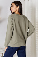 Women’s V-neck long sleeve cotton blend T-shirt, casual women’s apparel from Trendsi, shown in a neutral color and relaxed fit.
