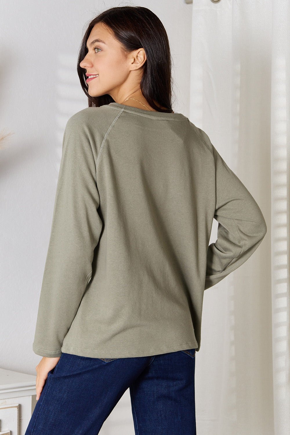 Women’s V-neck long sleeve cotton blend T-shirt, casual women’s apparel from Trendsi, shown in a neutral color and relaxed fit.