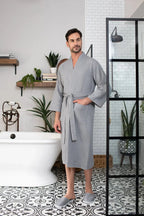 Absorbent, lightweight men's waffle spa bathrobe by Plush Fashion Hub, shown hanging with a cozy, textured fabric appearance.