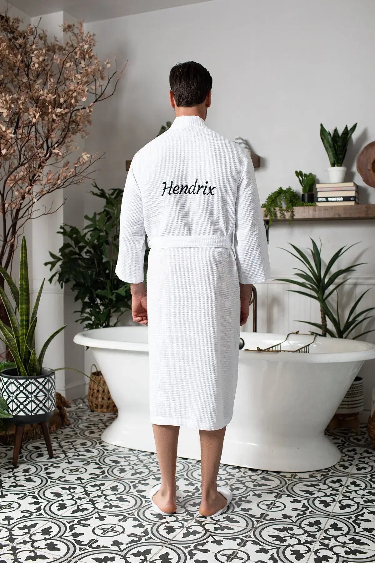 Men's plush waffle spa bathrobe from Plush Fashion Hub, lightweight and absorbent, shown hanging with a relaxed fit and textured fabric.