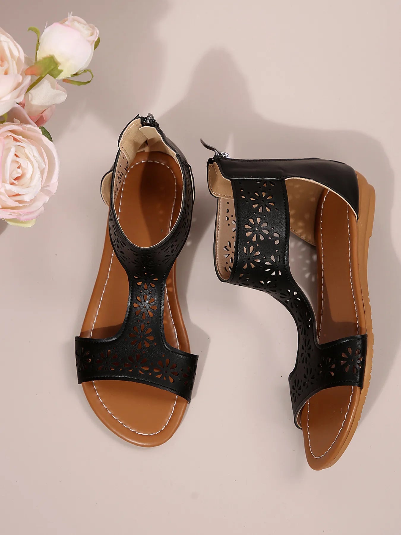 Women's stylish cutout open toe flat sandals made of vegan leather, featuring a trendy design and comfortable fit.
