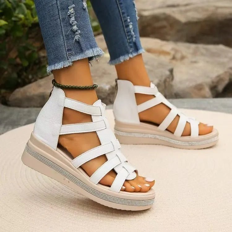 Women's rhinestone cutout wedge sandals with sparkling trim, featuring comfortable design and stylish dress shoe style.