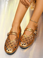 Women's vegan leather round toe flat sandals with cutout design, trendy and comfortable for everyday wear.