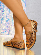 Women's vegan leather flat sandals with cutout design and round toe, comfortable everyday shoes by Trendsi.