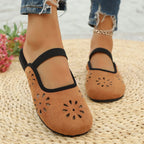 Women's slip-on flats with cutout design and round toe in premium PU leather, stylish and comfortable footwear by Trendsi