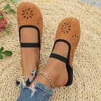 Women's slip-on flats with cutout design and round toe in premium PU leather, stylish and comfortable footwear by Trendsi.