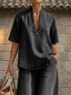Plus size women's dress with half-sleeve top and wide-leg pants set by Trendsi, featuring a stylish, comfortable matching outfit.