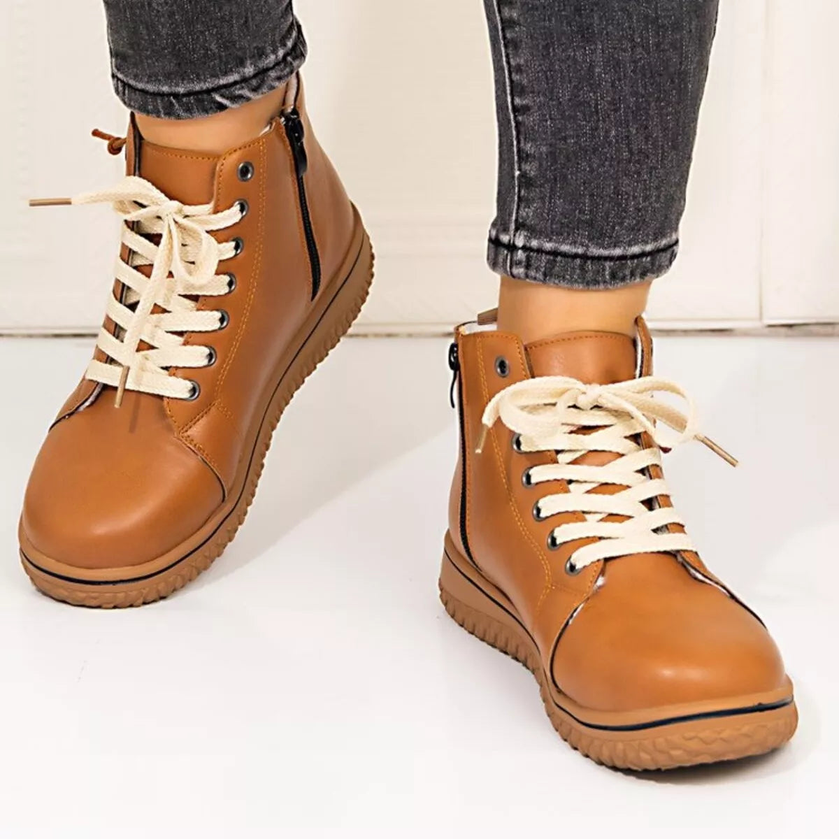 Women's round toe platform ankle boots by Trendsi, stylish black shoes with chunky heels and ankle-length design.