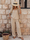 Women's embroidered V-neck top and wide-leg pants set by FitiqueFit, shown in multiple colors, featuring floral embroidery and relaxed fit.