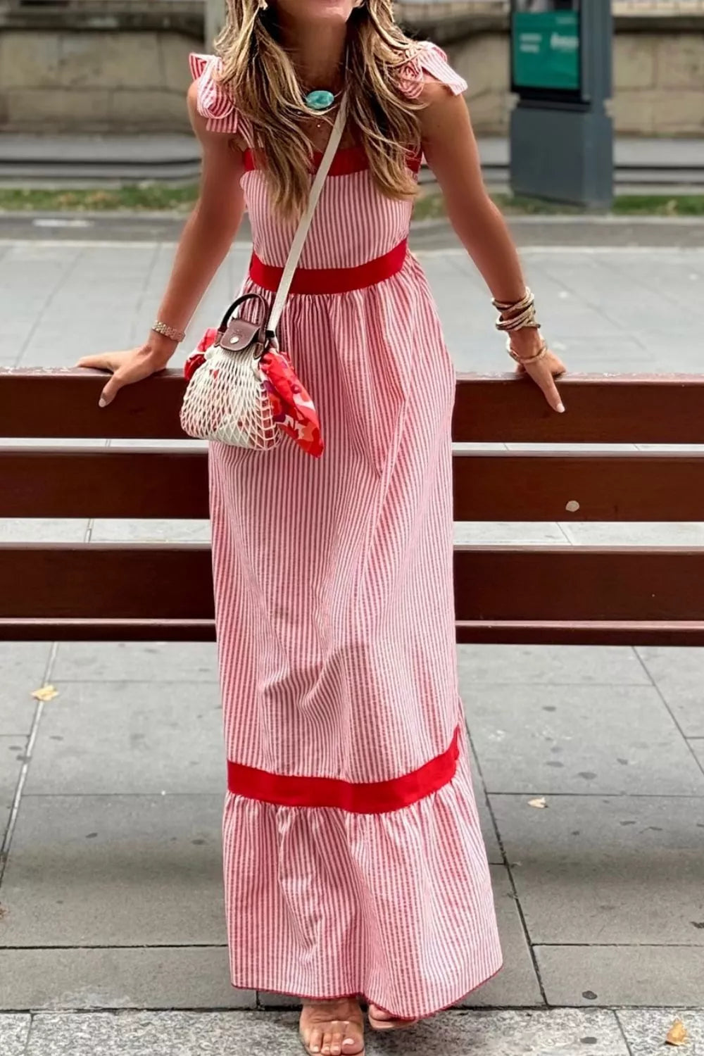 Plush Fashion Hub striped bow knot maxi dress with contrast trim, high waist, ruffle hem, and bow straps on a model.