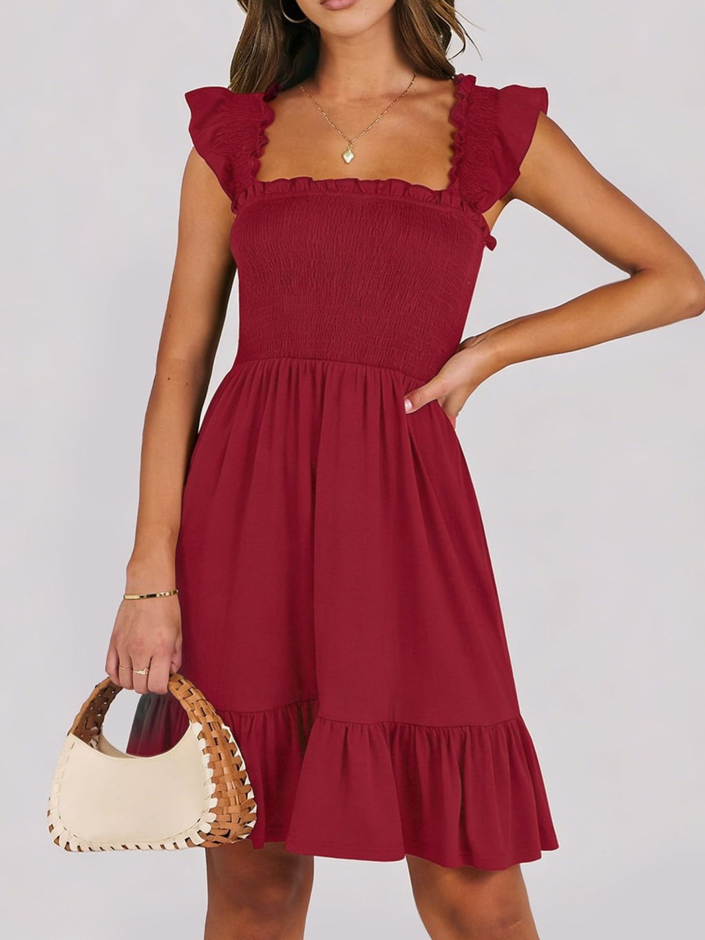 Women's lightweight smocked ruffle hem mini dress by Trendsi, casual summer dress with breezy, relaxed fit and feminine ruffle details.