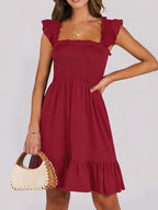 Women's lightweight smocked ruffle hem mini dress by Trendsi, casual summer dress with breezy, relaxed fit and feminine ruffle details.