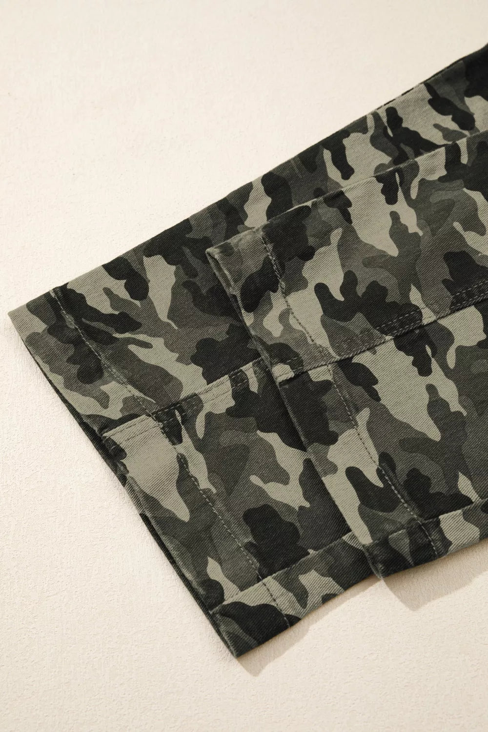 Camouflage print women's denim pants with multiple pockets, stylish and functional, from Shopimist.
