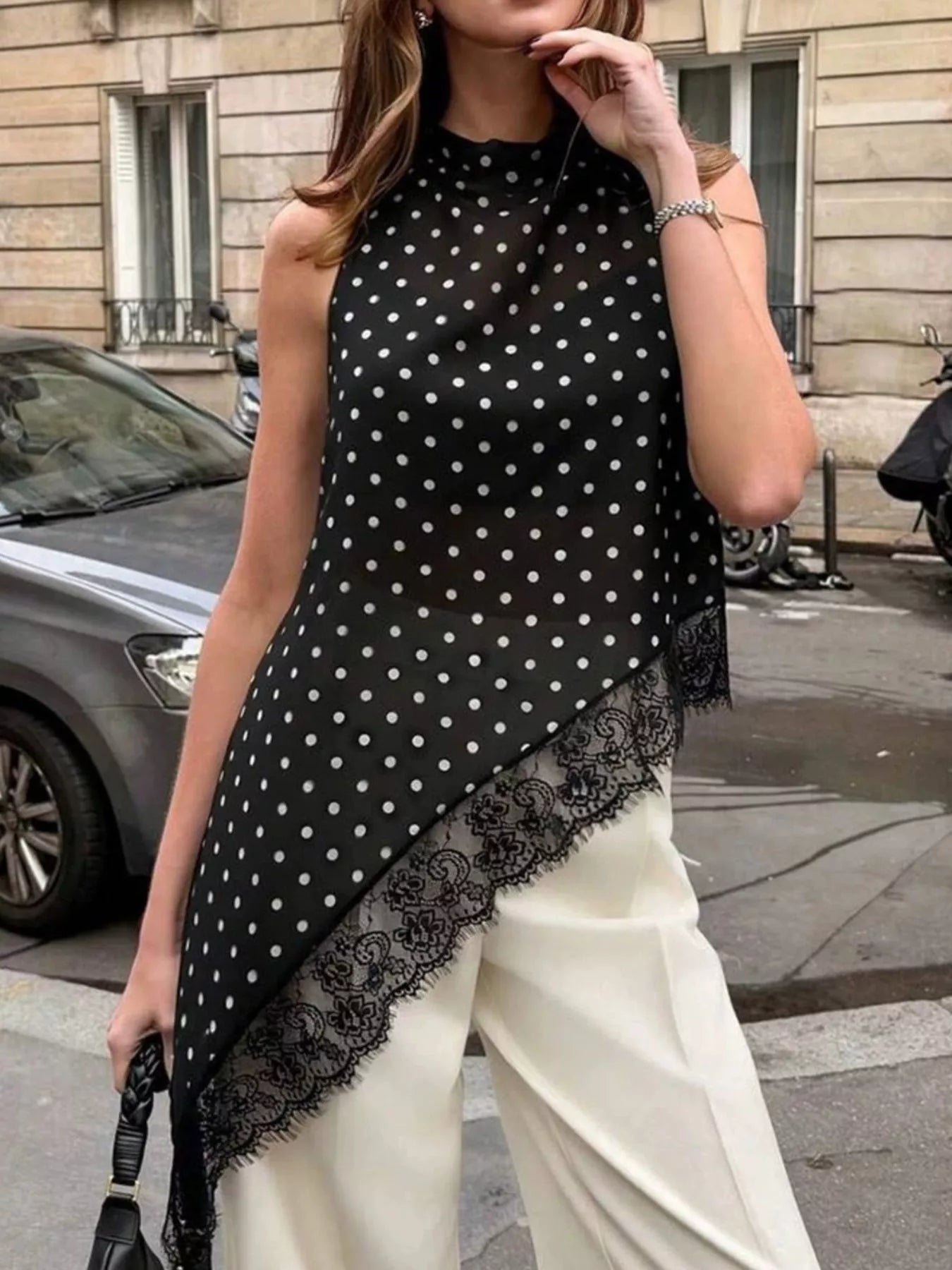 Polka dot lace trim sleeveless blouse with asymmetrical hem from Plush Fashion Hub, featuring a stylish and feminine shirt design.