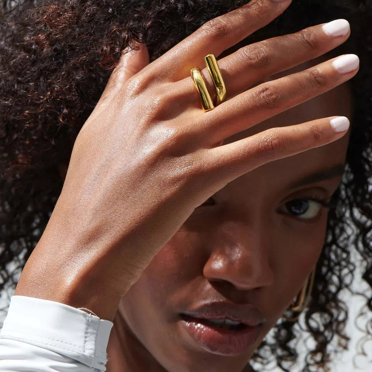 Stainless steel bypass ring from Plush Fashion Hub, featuring a sleek, modern design with smooth, curved band for stylish wear.
