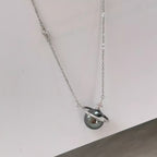 Elegant Planet Pearl Pendant Necklace by Shopimist featuring a lustrous pearl pendant on a delicate chain.