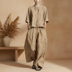Three-quarter sleeve shirt and loose trousers two-piece set by FitiqueFit, featuring a stylish, relaxed fit in neutral fabric.