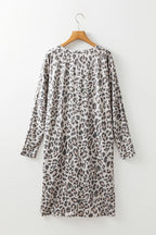 Leopard print V-neck long sleeve dress by Plush Fashion Hub, stylish and fitted with a flowing silhouette.