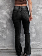 Distressed flare denim jeans from Plush Fashion Shop, featuring ripped details and a high-waisted fit, styled on a model.