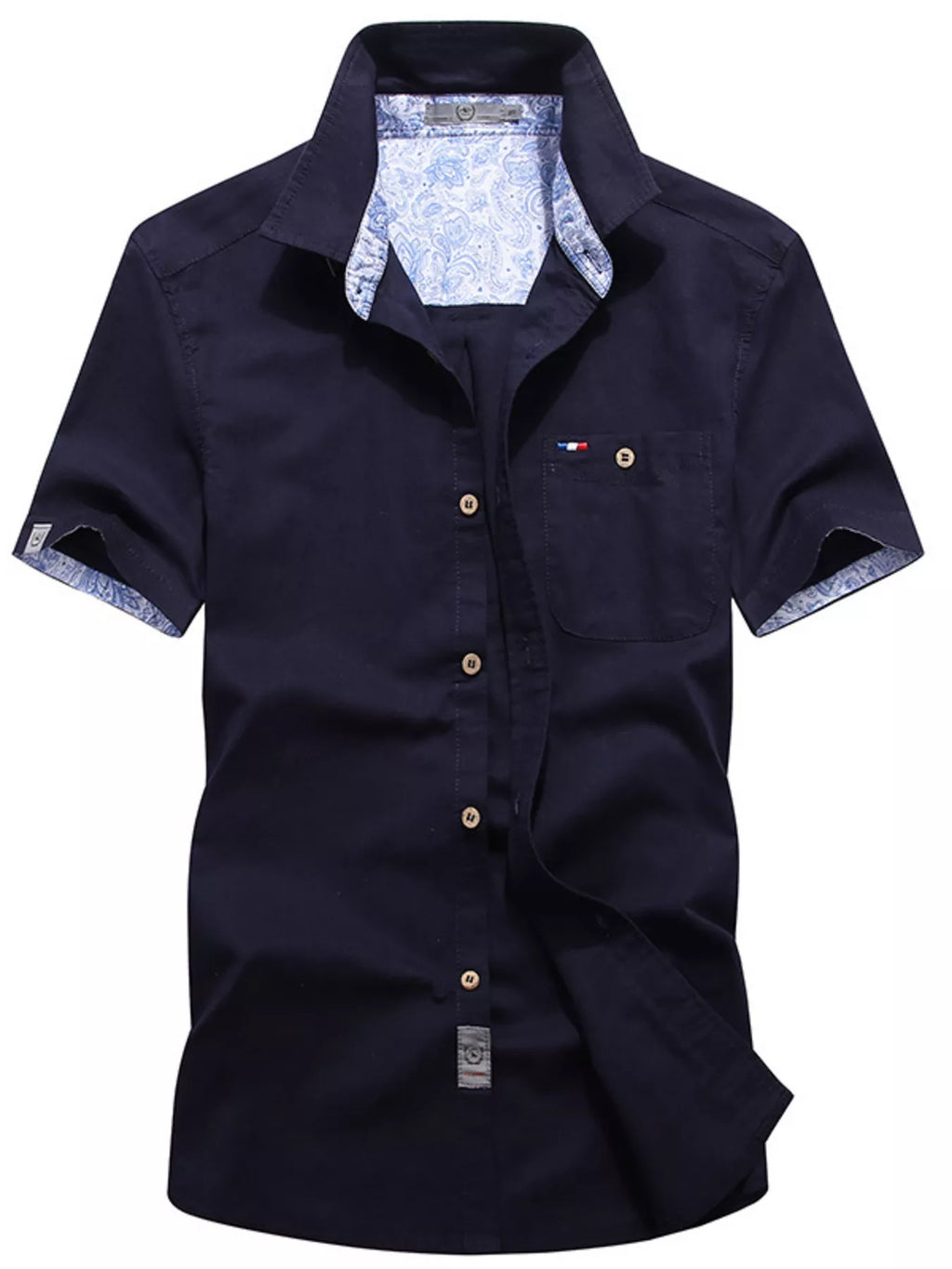 Men's casual short-sleeve button-up shirt in plus size by Trendsi, with a relaxed fit and classic collar, shown on a model.